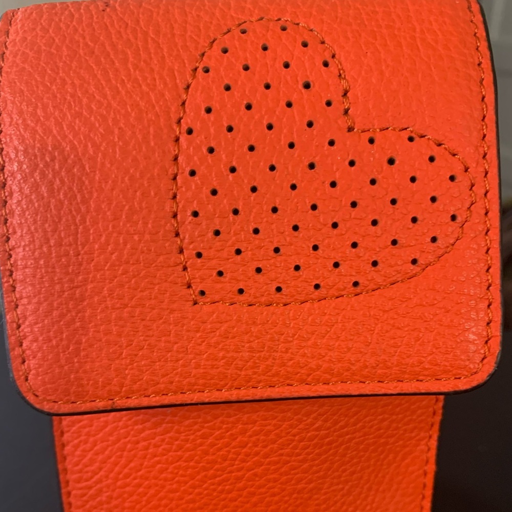 🍊💥🤎🤍🤎HENRI BENDEL - Tangerine perorated heart  phone case/lariat bag.